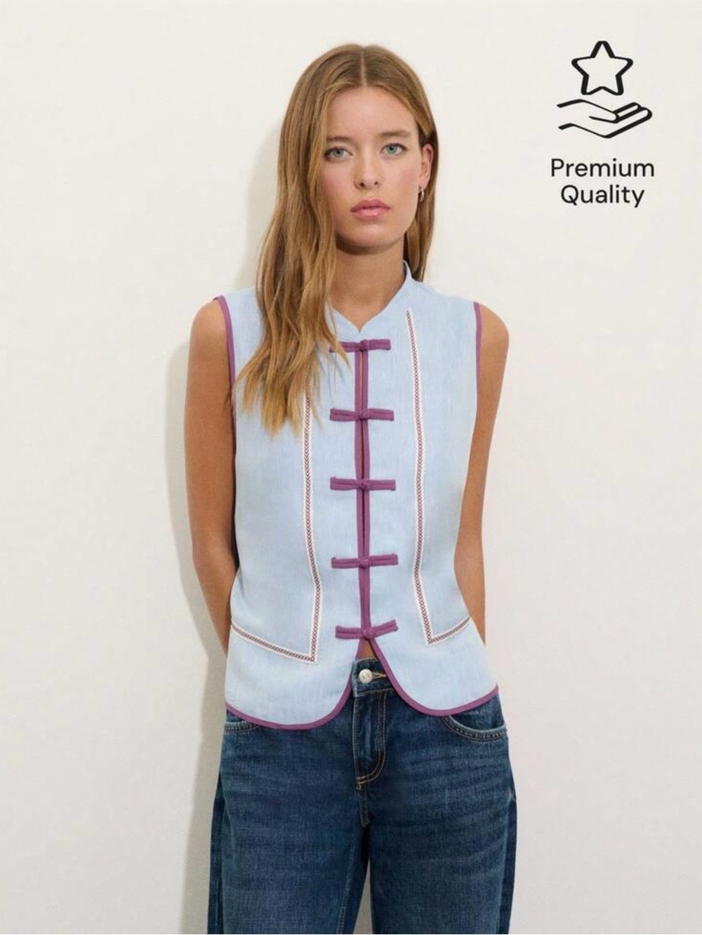 Light Blue Sleeveless Vest with Purple Trim Accents